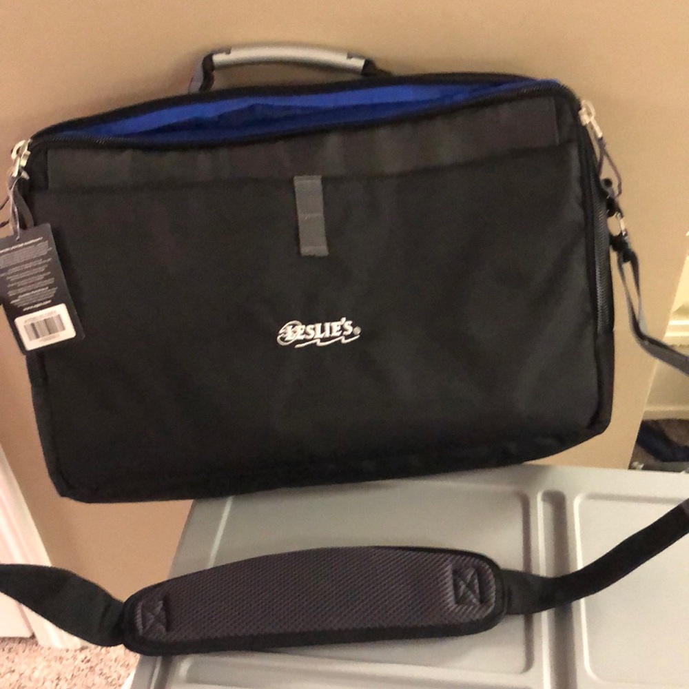 NWT black soft sided messenger bag.